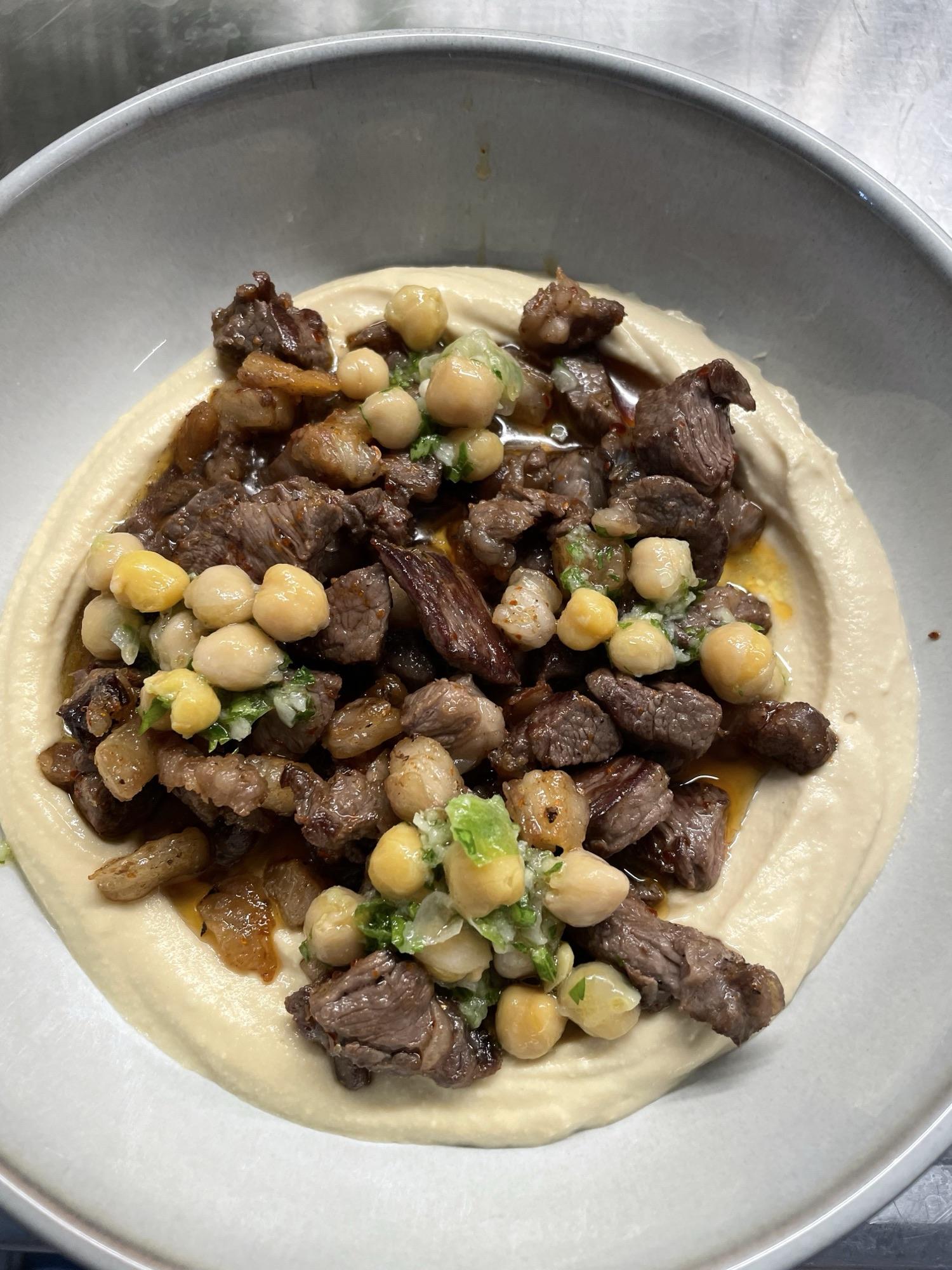 Meat on hummus